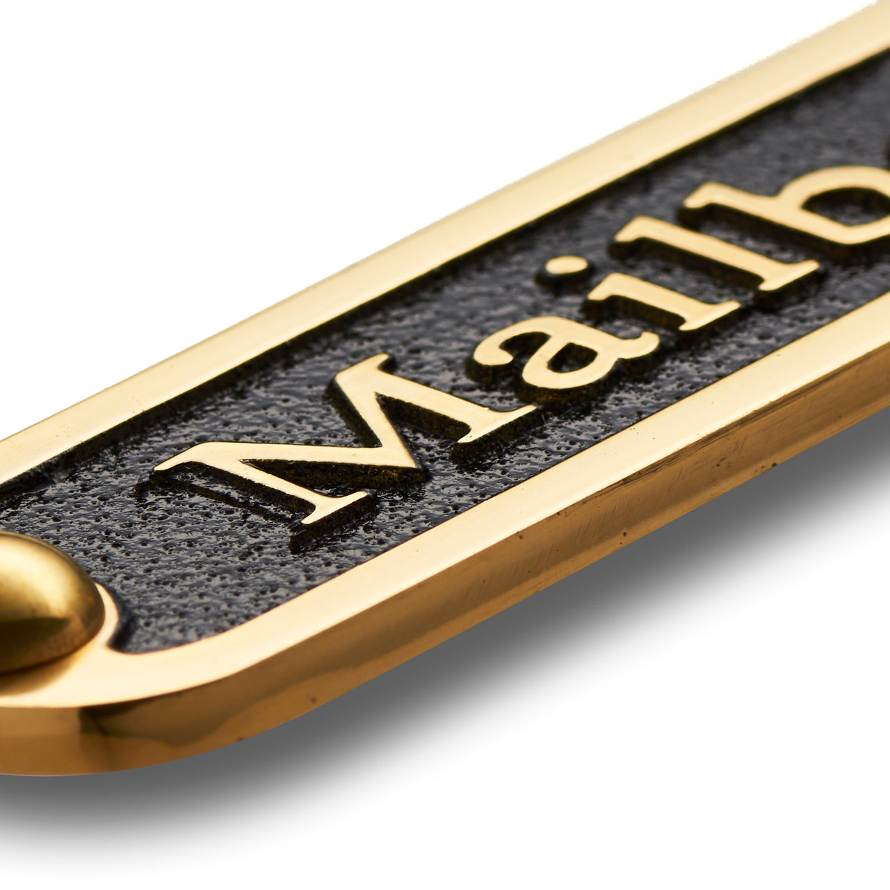 Close up of Mailbox door sign highlighting the shine, texture and quality